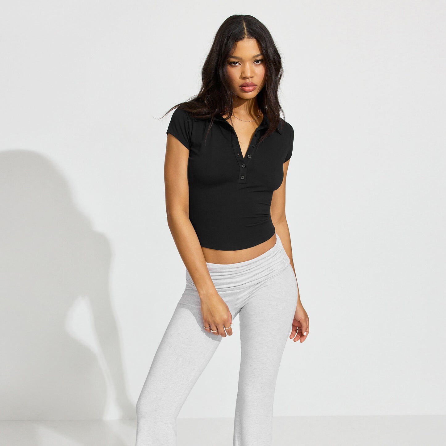 2025 spring and summer new European and American POLO collar button short sleeve tight sports waist versatile top fashionable and loose, leading the trend!